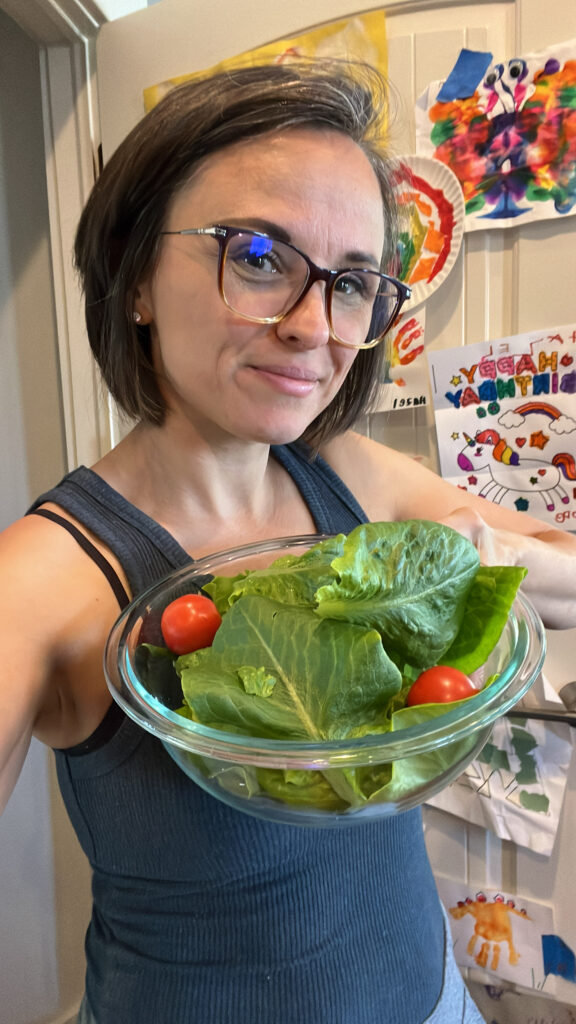 Megan with Homegrown Lettuce and Tomatoes